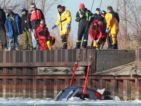 A stolen vehicle is pulled from the Detroit River near Mill Street and Russell Street on Saturday, December 28, 2013. Police said the vehicle was stolen early Saturday morning. (DAX MELMER/ The Windsor Star)