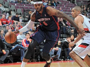 Detroit's  Josh Smith, left, drives to the net against the Portland Trail Blazers on December 15, 2013 at The Palace of Auburn Hills in Auburn Hills, Michigan.  (Allen Einstein/NBAE via Getty Images)