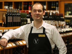 Product consultant Aaron Pitcher, at the Roundhouse LCBO in Windsor, gives tips on how to select the perfect gift wine for the holiday season. (TYLER BROWNBRIDGE / The Windsor Star)
