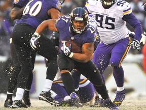Baltimore running back Ray Rice runs the ball against Minnesota December 8, 2013 in Baltimore,. The Ravens beat the Vikings 29-26.  (Larry French/Getty Images)