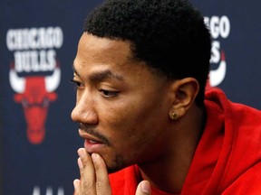 Chicago Bulls guard Derrick Rose talks to the media about his injured knee at the United Center Thursday, Dec. 5, 2013, in Chicago. (AP Photo/Charles Rex Arbogast)