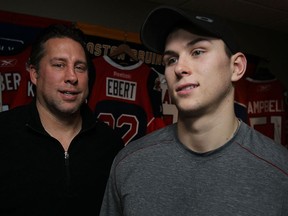 Spits GM Warren Rychel, left, and his Kerby Rychel are photographed Tuesday night after Warren traded his son to the Guelph Storm. (TYLER BROWNBRIDGE/The Windsor Star)