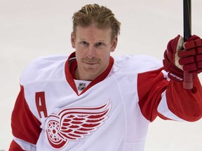 Former Ottawa Senators captain Daniel Alfredsson acknowldges the crowd prior to the start of NHL action Sunday in Ottawa. The game was Alfredsson's first in Ottawa since being traded to the Red Wings. (THE CANADIAN PRESS/Adrian Wyld)