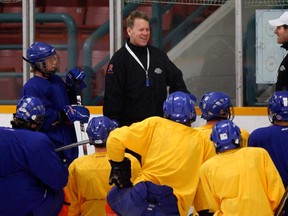 Windsor native Robb Serviss, centre, talks to players on the Netherlands' under-18 team during a practice at South Windsor Arena last year. Serviss was named head coach of the Belle River Canadiens Thursday. (NICK BRANCACCIO/The Windsor Star)