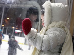 Elizabeth Jacobs watches skaters brave the cold to ring in the new year at Lanspeary Park in Windsor on Tuesday, December 31, 2013. (TYLER BROWNBRIDGE/The Windsor Star)