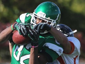 Herman receiver Devon Woods, left, fights for a catch against Sandwich in WECSSAA boys football action. Woods is among the Tier I East Conference all-stars.  (JASON KRYK/Windsor Star files)