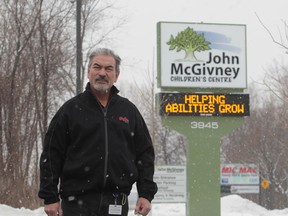 Lloyd Ayotte, facility manager for the John McGivney Children's Centre in Windsor, Ontario is hoping someone will return the extension cord stolen from the front lawn of the Matchette Road centre.  The extension cord ran power to the Christmas lights on a tree in front. (JASON KRYK/The Windsor Star)