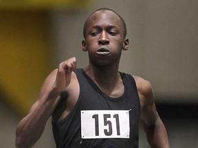 Josh Nidolo of Kenya competes in the 100 metres during the U of W Blue and Gold meet Mon. Dec. 2, 2013, at the St. Denis Centre in Windsor. (DAN JANISSE/The Windsor Star)