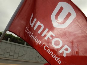 The flag of Unifor flies during a Labour Day parade on Walker Rd. in Windsor, Ont. in September 2013. (Dax Melmer / The Windsor Star)