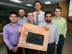 The University of Windsor students Peter Deng, left, Said Said, Christian Janisse, Blake Pauls, Nawaf Almutairi and Tim Doermer formed Grasshopper Bags. They designed a lawn mower bag attachment and recyclable bags to make getting rid of grass clippings easier. (DAN JANISSE/The Windsor Star)