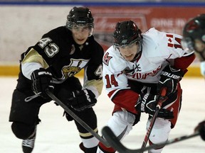 Leamington's Nathan Opblinger, right, skates in front of LaSalle's Daniel Beaudoin during junior B hockey action at the Vollmer Centre in LaSalle on Wednesday, December 11, 2013. (TYLER BROWNBRIDGE/The Windsor Star)