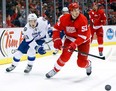 Tampa Bay's Valtteri Filppula and his former Detroit teammate Jonathan Ericsson battle for the puck.