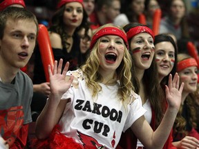 Brennen students Alex Keys, left, Justice Williamson-Deneau, Taylor Hryniw, Andrea Bisutti, Ayla Hadland and Mandy Johnstone cheer during Zakoor Cup at the WFCU Centre, Thursday December 19, 2013.  Brennan defeated St. Joseph 4-2. (NICK BRANCACCIO/The Windsor Star)