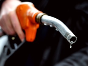 Files: A man pumps gasoline into his vehicle. (Getty Images files)