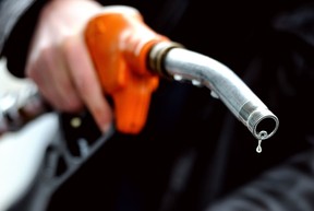 Files: A man pumps gasoline into his vehicle. (Getty Images files)