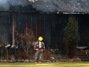Kingsville fire crews work to extinguish a house fire on Road 8 East between North Talbot Road and Graham Side Road Saturday, Jan. 11, 2014.  No injuries were reported.  (DAX MELMER/The Windsor Star)