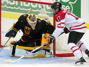 Otters forward Connor McDavid, right, scores on Germany goaltender Marvin Cupper at the World Junior Hockey Championships in Malmo, Sweden. (THE CANADIAN PRESS/ Frank Gunn)