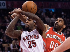 Toronto's John Salmons, left, is guarded by Milwaukee's O.J. Mayo Monday in Toronto. (THE CANADIAN PRESS/Nathan Denette)