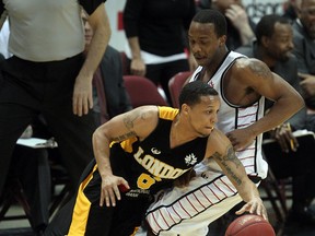 Express guard Stefan Bonneau, right, guards London's Adrian Moss at the WFCU Centre. (NICK BRANCACCIO/The Windsor Star)