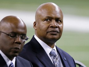 New Lions head coach Jim Caldwell, right, sits next to general manager Martin Mayhew at Ford Field in Detroit Wednesday. (AP Photo/Carlos Osorio)