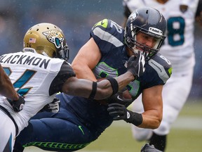 Rookie tight end Luke Willson #82 of the Seattle Seahawks is tackled by cornerback Will Blackmon #24 of the Jacksonville Jaguars at CenturyLink Field on September 22, 2013 in Seattle, Washington. The Seahawks defeated the Jaguars 45-17.  ( Otto Greule Jr/Getty Images)