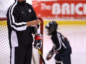 Dave Matsos skates with a group of children taking part in a Spitfires camp at the WFCU Centre in 2012. (The Windsor Star/TYLER BROWNBRIDGE)