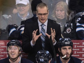 Ex-Spit Paul Maurice, top, is back behind the bench with the Winnipeg Jets. (Photo by Marianne Helm/Getty Images)