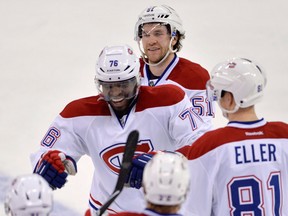 Montreal's P.K. Subban, centre, celebrates his winning goal in overtime against the Senators Thursday. (THE CANADIAN PRESS/Adrian Wyld)
