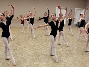 Local ballet dancers Arabella Dion, left, Hannah Gravelle and Brooke Rorseth, right, perform during auditions Monday, Jan. 20, 2014, at Windsor's Edmunds Towers School of Dance, 2555 Jefferson Ave., for admission to the Royal Winnipeg Ballet school in Winnipeg. There were openings for full-time students, Grades 6 to 12, as well as for two post-secondary programs designed for teachers-in-training. Master classes were also held for students ages 10 to 13 and 14 and older. (NICK BRANCACCIO/The Windsor Star)