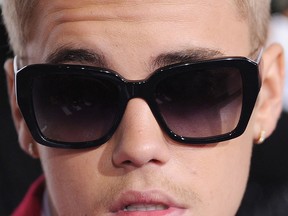This Dec. 18, 2013 file photo shows Justin Bieber arriving for the world premiere of "Justin Bieber's BELIEVE" at the Regal Cinemas at LA Live in Los Angeles. Police served a felony search warrant and searched Bieber’s house during a vandalism investigation Jan. 14, 2014.
(ROBYN BECK/AFP/Getty Images)