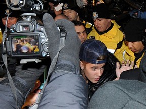 Justin Bieber appears at a police station in connection with an alleged criminal assault on January 29, 2014 in Toronto.  (Photo by Jag Gundu/Getty Images)