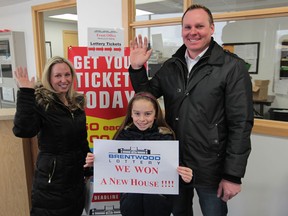 Brentwood Lottery dream home winners Kim Howell along with her daughter, Emily and husband Jason, are all smiles on January 9, 2014.  (JASON KRYK/The Windsor Star)