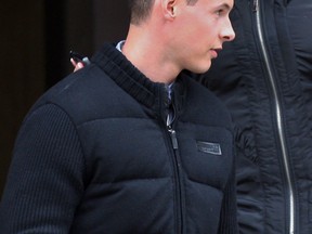 Kyle Brown, front, leaves Provincial Offences Office at Westcourt Building Wednesday, January 15, 2014. (NICK BRANCACCIO/The Windsor Star)