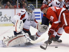 Detroit's Joakim Andersson, right, tries to score a goal against Capitals goalie Braden Holtby at Joe Louis Arena. (AP Photo/Carlos Osorio)