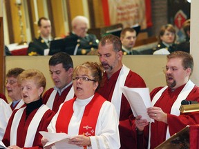 In this file photo, Rev. Sue Paulton, centre, and her son Christian Paulton, right, lead the St. Mark's and St. David's church choirs during the 41st Annual Civic Service "Celebrate the City" held Sunday, Jan. 13, 2008, at St. Mark's Anglican Church on Tecumseh Road West.  Dozens of civic leaders including Windsor Police Chief Glenn Stannard, city councillors Caroline Postma and Dave Brister, Hotel-Dieu Grace Hospital CEO Neil McEvoy, Rotary District 6400 governor Jennifer Jones, Hospice executive director Carol Derbyshire and others attended the service offficiated by Paulton. The Royal Canadian Sea Cadet Corps Agamemnon brought colours and The Windsor Regiment Band provided music.  (The Windsor Star/ Nick Brancaccio)