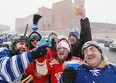 Justin Abbot, 26, left, Brett Banfill, 24, Ryan Abbott, 24, Lane Landry, 24, Ryan Allen, 26, and Jeff Abbot, 57, all from Windsor Ont., tailgate outside Michigan Stadium before the start of the 2014 Bridgestone NHL Winter Classic between the Detroit Red Wings and the Toronto Maple Leafs, Wednesday, January 1, 2014.  Toronto defeated Detroit 3-2 in a shootout.   (DAX MELMER/The Windsor Star)