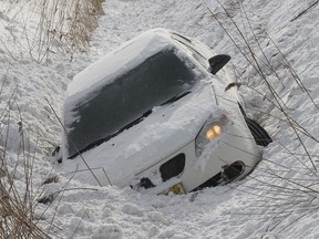 File photo of a vehicle in a ditch. Tow truck operators were kept busy Monday, Jan. 6, 2014, as roads were slick with drifting snow. Here a car sits in a ditch on Manning Road north of County Road 42. No one was injured in the early afternoon accident. (DAN JANISSE/The Windsor Star)