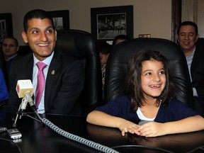 Mayor Eddie Francis was assisted by his daughter Sienna, 6, right, during his announcement he will not be seeking a fourth term as mayor, January 10, 2014. (NICK BRANCACCIO/The Windsor Star)
