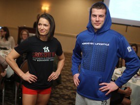 Charelle Anobile, left, and Greg Bennett model sportswear at the Savvy Sweats and Sweets event, hosted by Leadership Advancement for Women and Sport at the Holiday Inn Hotel and Suites, Sunday, Jan. 26, 2014.   (DAX MELMER/The Windsor Star)