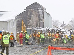 Police, firefighters and other investigators comb through the rubble of the Résidence du Havre seniors’ home in L’Isle-Verte, Quebec, Tuesday, Jan. 28, 2014, looking for human remains and other clues. A deadly fire destroyed the home last Thursday. (Photograph by: Phil Carpenter, The Gazette)