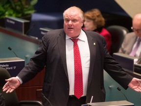 Toronto Mayor Rob Ford speaks from the council floor at city hall in Toronto on Thursday, January 30, 2014. Toronto's bad boy mayor Rob Ford on Thursday defended troubled pop star Justin Bieber after police in Canada's largest city charged the teenager with assault, his second arrest in a week. "He's a young guy, 19 years old. I wish I was as successful as he was," Ford told a Washington radio show, urging listeners to "think back" to when they were teenagers. Bieber was charged Wednesday with assaulting a limousine driver in Toronto last month. (THE CANADIAN PRESS/Chris Young)