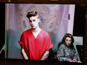 Justin Bieber appears in court via video feed, Thursday, Jan. 23, 2014, in Miami. Bieber has a Valentine's Day date with a South Florida judge on charges of driving under the influence of alcohol, resisting arrest and driving with an expired licence. (AP Photo/The Miami Herald, Walter Michot, Pool)