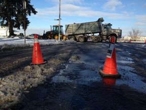 Riverside Drive was reduced to one lane Tuesday morning following a water main break near McEwan Avenue. (TwitPic: Nick Brancaccio/The Windsor Star)