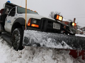 Dan Martinello, a City of Windsor snowplow operator, removes snow from city streets Sunday, Jan. 5, 2014.  (DAX MELMER/The Windsor Star)