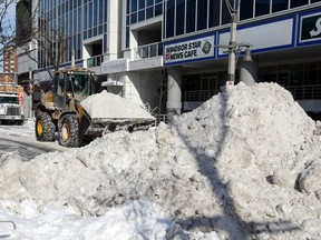 City of Windsor snow removal crews tackle downtown Windsor, going block by block, shutting down traffic temporarily January 8, 2014. (NICK BRANCACCIO/The Windsor Star)