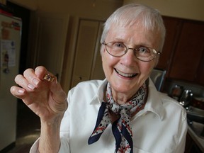 Iris Burns Brown is pictured with a ring that once belonged to William James Burns after it was recently returned to the family, Sunday, Jan. 12, 2014.  William James Burns died in a place crash August 11, 1957.  (DAX MELMER/The Windsor Star)