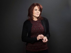 This Dec. 17, 2013 photo shows American singer-songwriter Rosanne Cash during a portrait session to promote her new album, "The River & The Thread" in New York. (Photo by Victoria Will/Invision/AP)