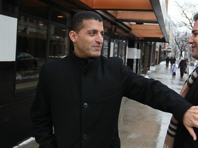 Mayor Eddie Francis, left, chats up with a supporter of his, Eric Kukucka, while on the street in downtown Windsor on the morning he announced he would not be running for a fourth term, Friday, Jan. 10, 2014. (DAX MELMER/The Windsor Star)