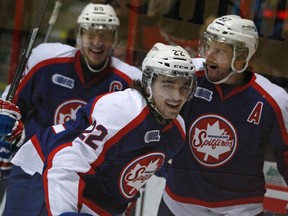 Windsor's Sam Povorozniouk, centre, is all smiles as he celebrates with teammates, Slater Koekkoek, left, and Brady Vail after scoring the opening goal as the Windsor Spitfires host the Sudbury Wolves at the WFCU Centre, Sunday, Jan. 19, 2014.  Windsor defeated Sudbury 3-1.   (DAX MELMER/The Windsor Star)