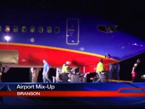 This frame grab provided by KSPR-TV shows a Southwest Airlines flight that was scheduled to arrive Sunday Jan. 12, 2014, at Branson Airport in southwest Missouri instead landed at an airport 7 miles north — with a runway about half the size of the intended destination. (AP Photo/KSPR-TV)